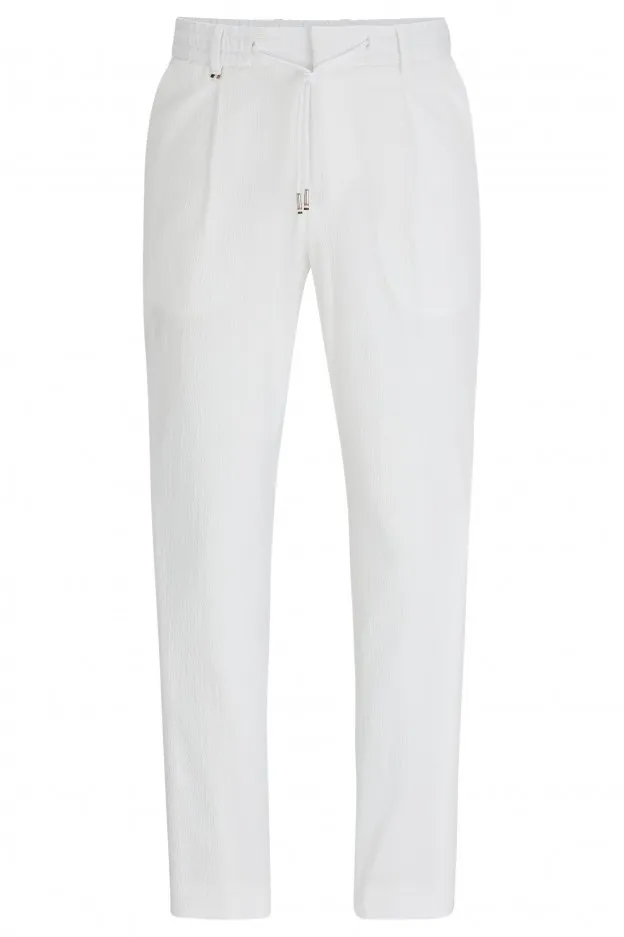Boss - Hugo Boss Boss - Hugo Boss pantaloni relaxed fit in seersucker di misto cotone