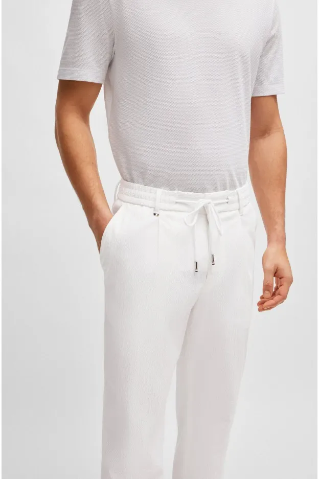 Boss - Hugo Boss Boss - Hugo Boss pantaloni relaxed fit in seersucker di misto cotone