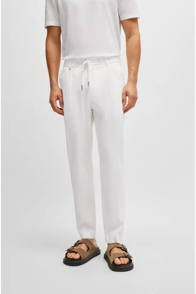 Boss - Hugo Boss Boss - Hugo Boss pantaloni relaxed fit in seersucker di misto cotone