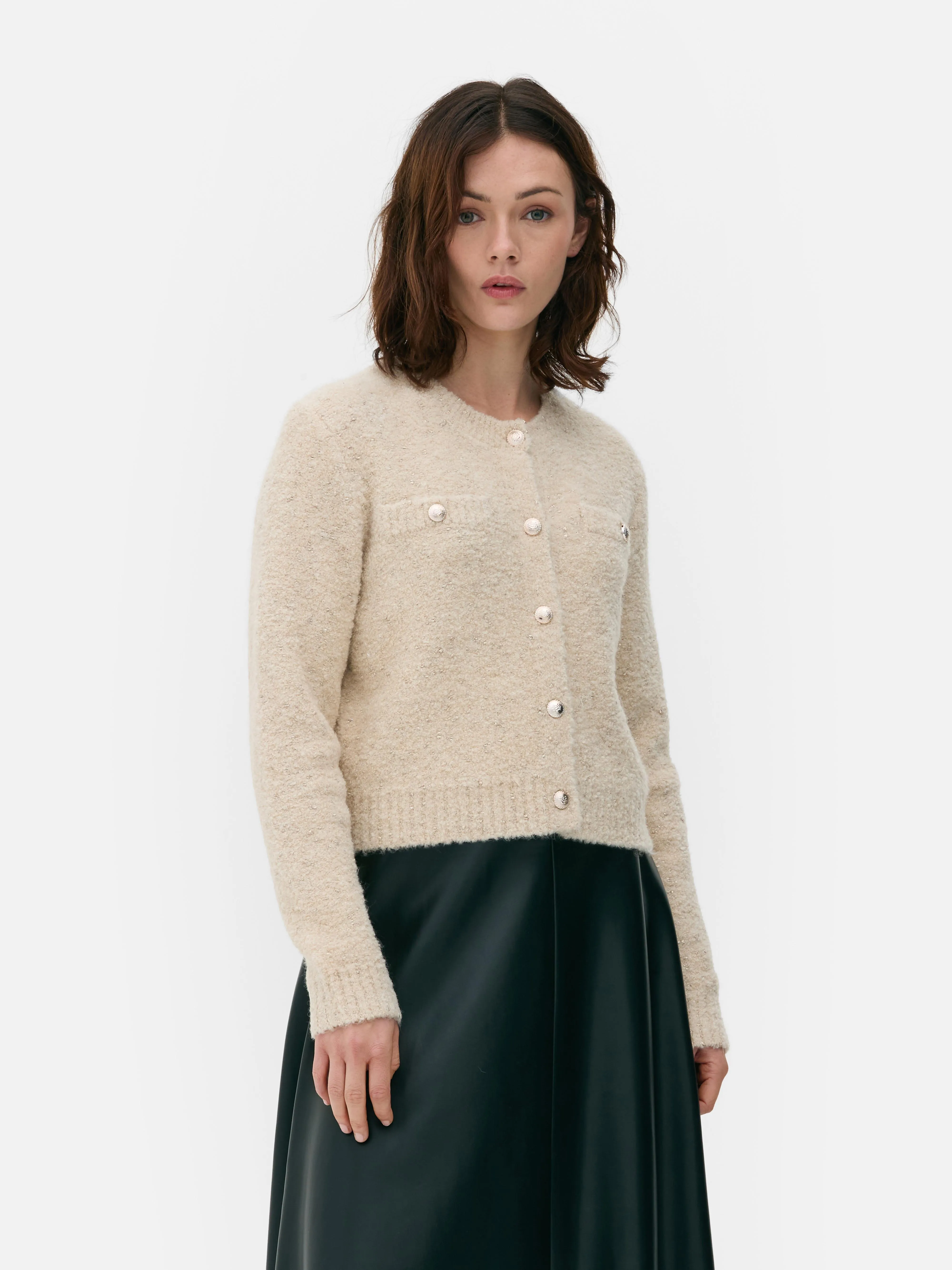 Cardigan scintillante con bottoni
